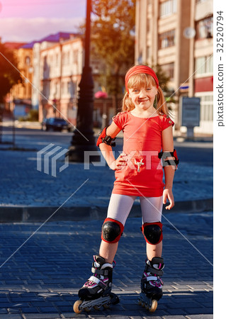 Pretty little girl in red t-shirt learning to 32520794