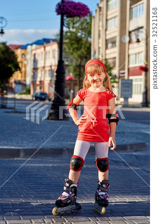 Girl riding on roller skates in skatepark summer Girl riding on roller skates in skatepark summer 32521168