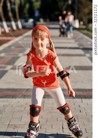 Girl riding on roller skates in skatepark summer 32521172