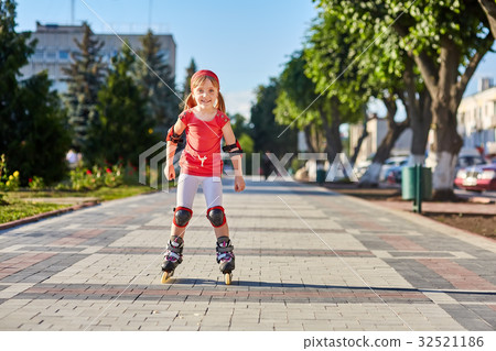 Girl riding on roller skates in skatepark summer Girl riding on roller skates in skatepark summer 32521186
