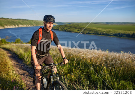 Traveler has adventur on meadow on riverside 32521208