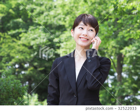 Business image Business woman speaking on a smartphone 32522033