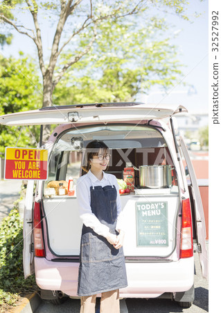 A woman opening a kitchen car 32527992