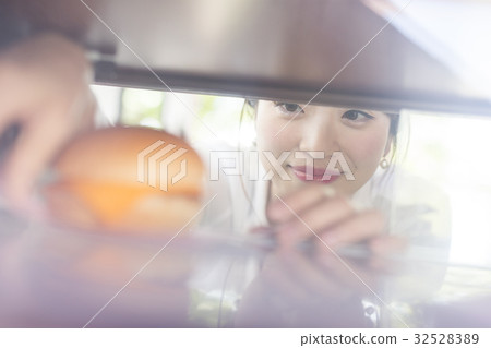 A woman watching bakery roast 32528389
