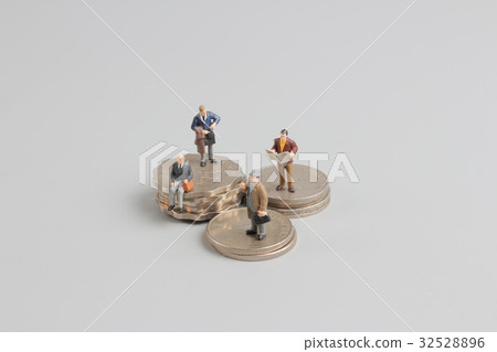 Business man on the top of coins stack 32528896