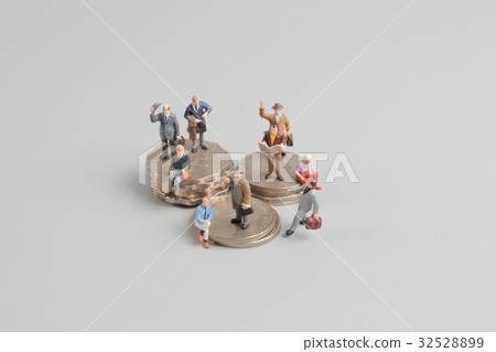 Business man on the top of coins stack Business man on the top of coins stack 32528899