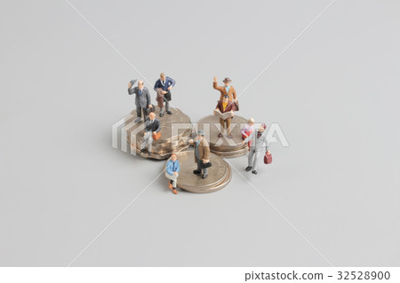 Business man on the top of coins stack 32528900
