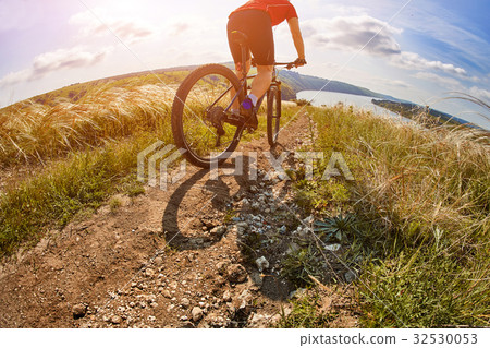 Adventure mountain biking on riverside Adventure mountain biking on riverside 32530053