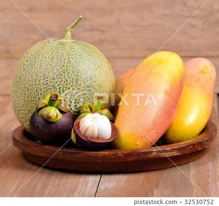 fresh various fruits on wooden background. 32530752