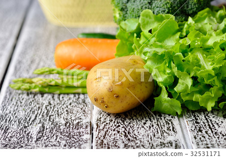vegetables isolated on a wooden background vegetables isolated on a wooden background 32531171