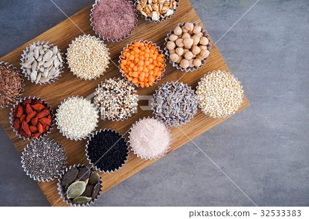 Various superfoods on gray table 32533383