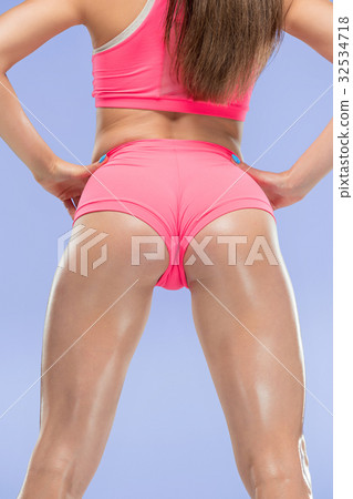 Muscular young woman athlete posing at studio Muscular young woman athlete posing at studio 32534718