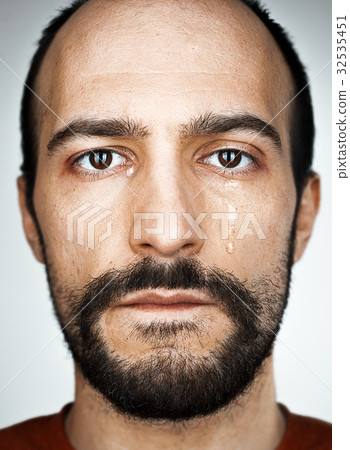 The crying man with tears on face closeup The crying man with tears on face closeup 32535451