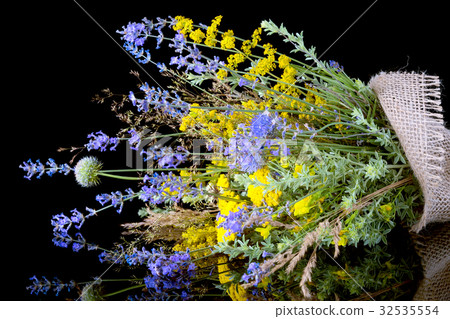 bouquet of fresh wildflowers on black background 32535554