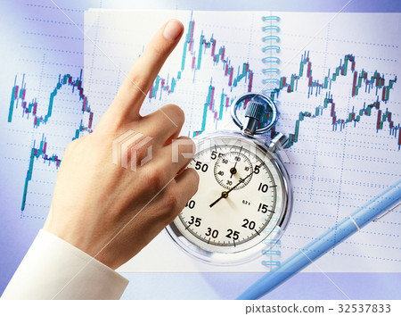 Candlestick graph chart, hand and stopwatch Candlestick graph chart, hand and stopwatch 32537833