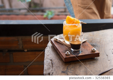 Fresh orange juice and intense Colombia coffee Fresh orange juice and intense Colombia coffee 32538365