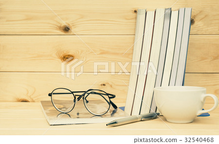 Books with glasses above. Book with glasses 32540468