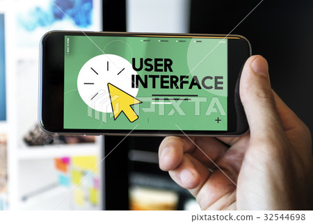 Close up of hand holding mobile with digital graphic 32544698