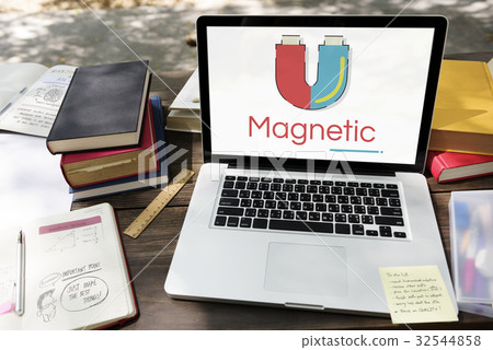 Illustration of horseshoe magnetic field energy on laptop 32544858