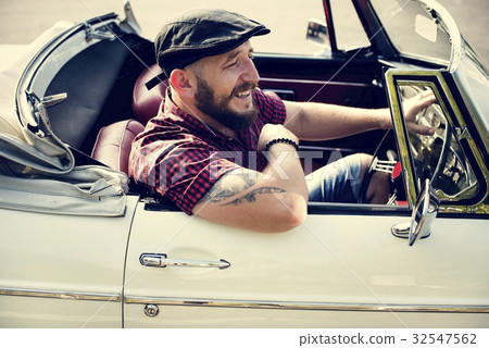 Man Driving a Car with Windows Down Man Driving a Car with Windows Down 32547562