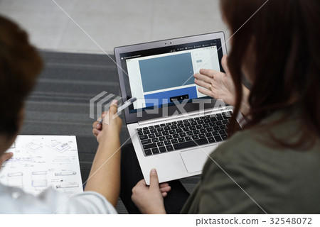 Woman working on laptop networking technology Woman working on laptop networking technology 32548072