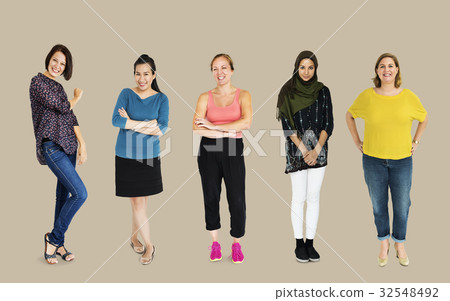 Diverse group of cheerful girls standing in a row Diverse group of cheerful girls standing in a row 32548492