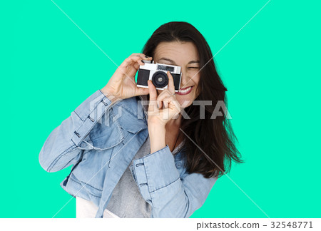 A woman using camera to capture A woman using camera to capture 32548771