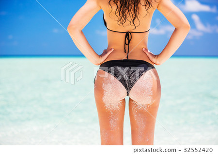 Young woman on the ocean beach Young woman on the ocean beach 32552420