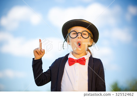 Funny little girl in glasses, bow tie and bowler Funny little girl in glasses, bow tie and bowler 32552462