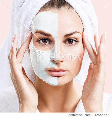 Beautiful woman with mask on her face. 32554538
