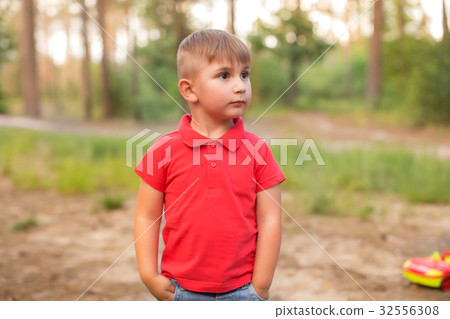 A cute boy in a summer park A cute boy in a summer park 32556308