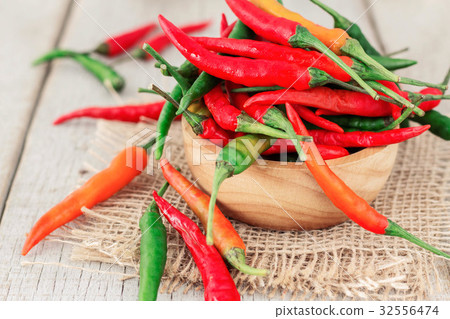 Fresh chilly on table. Fresh chilly on table. 32556474