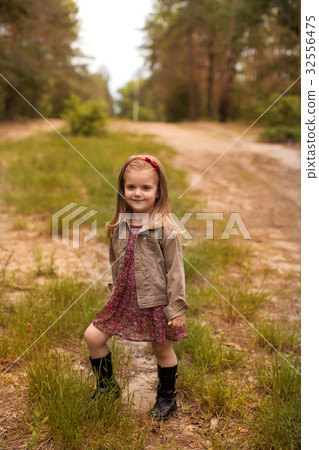 Happy girl in a summer park Happy girl in a summer park 32556475