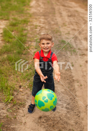 A cute boy in a summer park A cute boy in a summer park 32556500