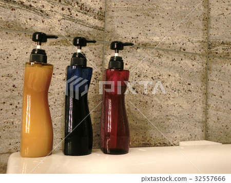 Red, blue and yellow shampoo containers Red, blue and yellow shampoo containers 32557666