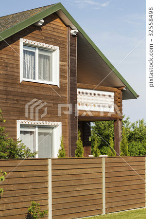 wooden house, green grass and a blue sky wooden house, green grass and a blue sky 32558498