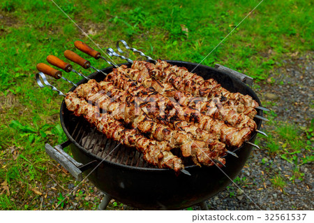 Grilling shashlik barbecue grill. Selective focus Grilling shashlik barbecue grill. Selective focus 32561537