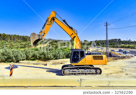 excavator in construction site yellow 32562290