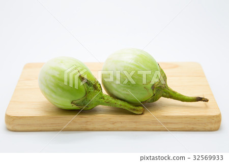 Thai eggplant on wooden board, on white Thai eggplant on wooden board, on white 32569933