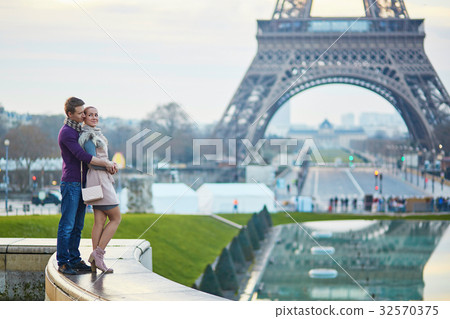 Couple near the Eiffel tower in Paris 32570375