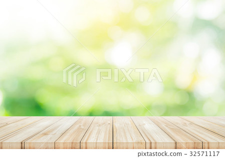 Empty wooden table top with blurred background. Empty wooden table top with blurred background. 32571117