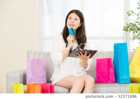asian woman using credit card online shopping asian woman using credit card online shopping 32571996