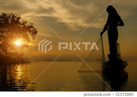 silhouette fisherman with sunset sky on the lake. silhouette fisherman with sunset sky on the lake. 32572095