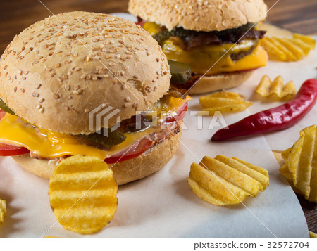 Freshly made burgers with crisps 32572704