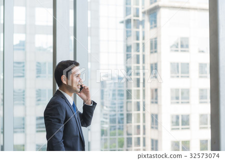 Mature and confident business executive looking  32573074