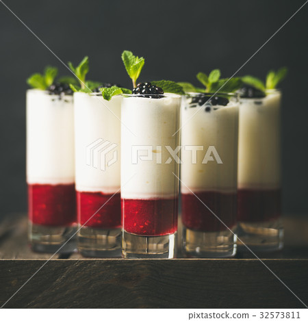 Dessert in glass with blackberries and mint, copy 32573811