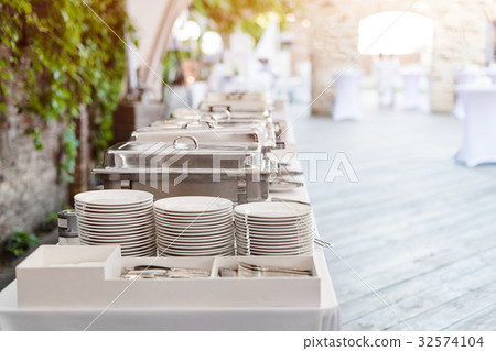 Buffet heated trays standing in line ready for 32574104