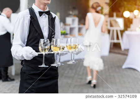 Midsection of professional waiter in uniform Midsection of professional waiter in uniform 32574109