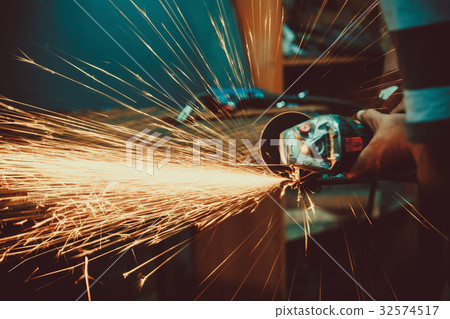 Sparks during cutting of metal angle grinder. 32574517
