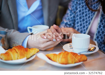 Romantic couple in Parisian cafe Romantic couple in Parisian cafe 32574762